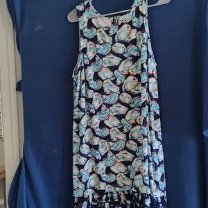 Oyster shell mini dress with tassels at the bottom